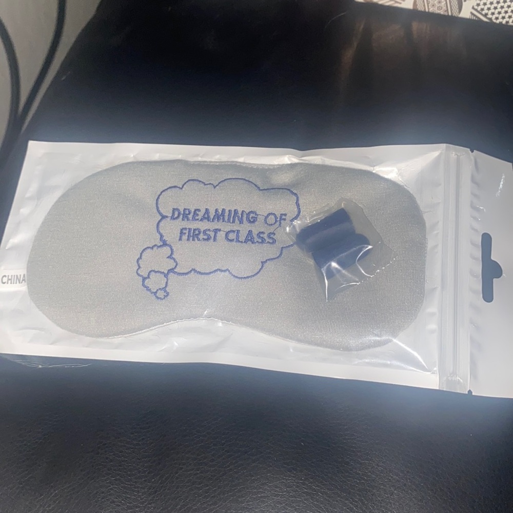 Travel sleep mask sealed with set of earplugs